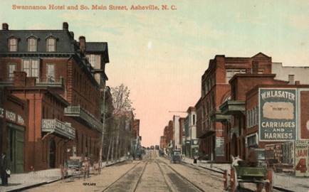 A street with buildings on either side of it
Description automatically generated with low confidence